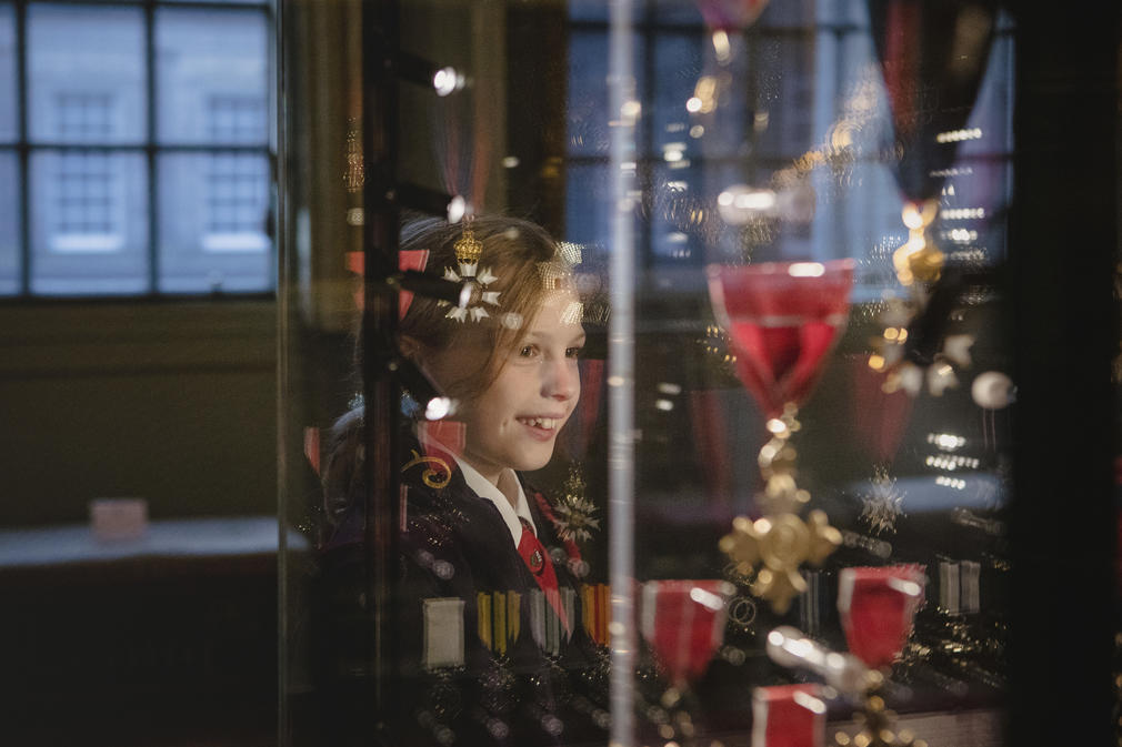 Child looking at medals