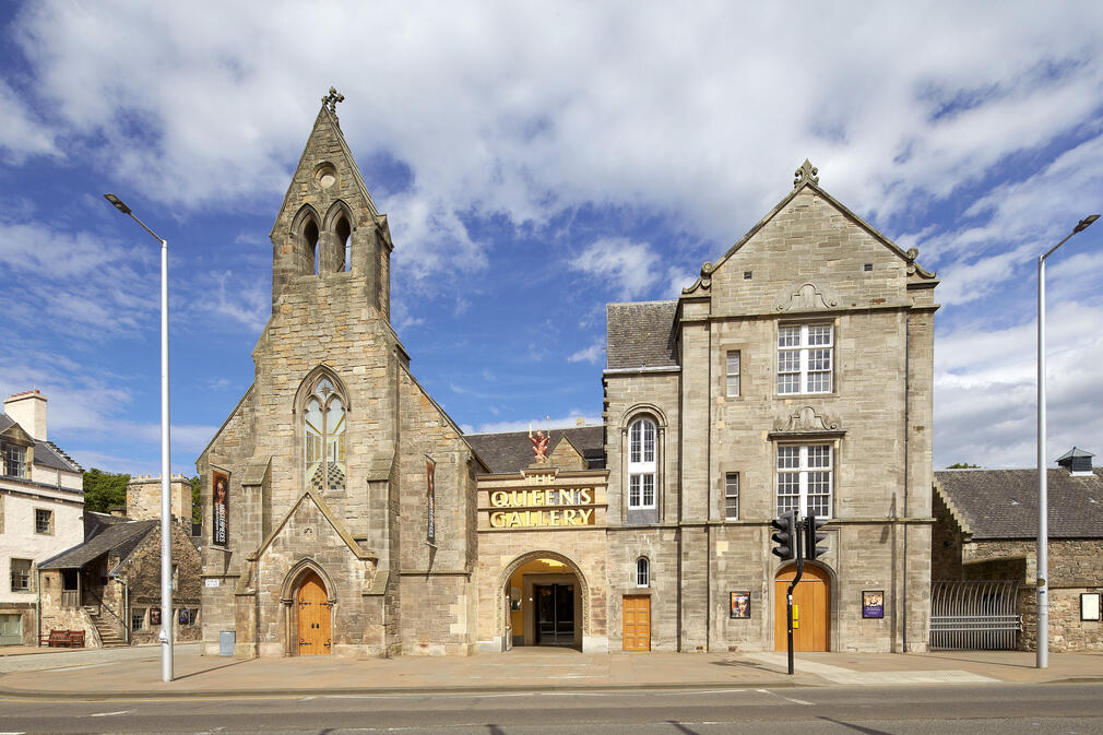 An image of the front of The Queen's Gallery, Palace of Holyroodhouse, showing the signage above the front doors. 