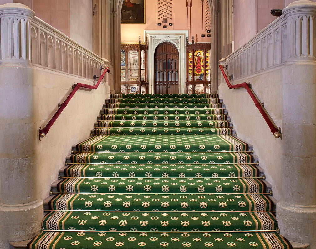 A view of the patterned green stairs leading up to a State Room at Windsor Castle