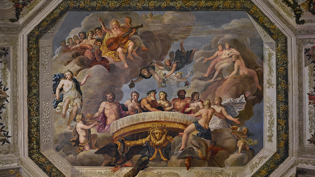 Ceiling painting showing gods, cherubs and a banquet by Antonio Verrio