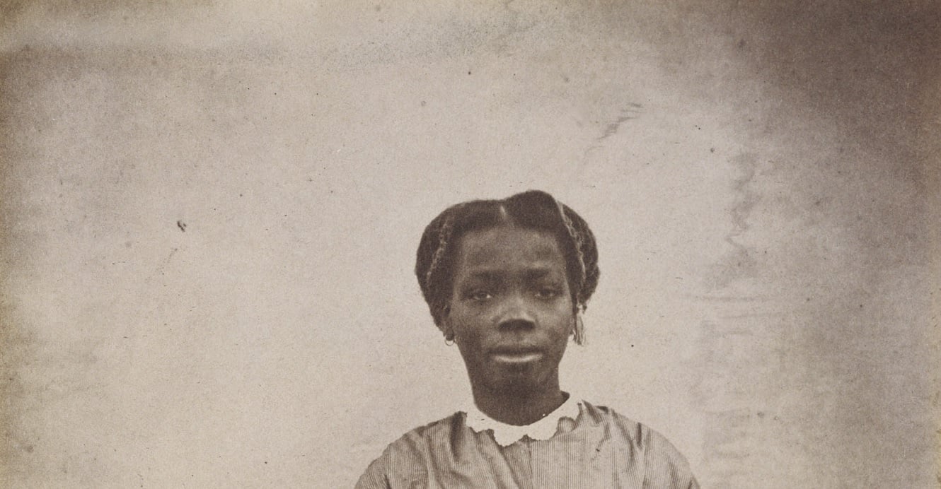 Portrait photograph showing a young lady in Victorian dress